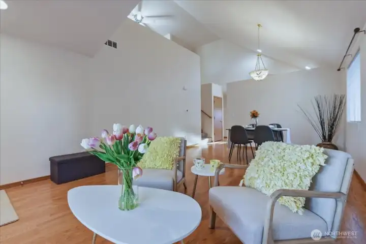 Living room, dining area, vaulted ceilings,laminate floor