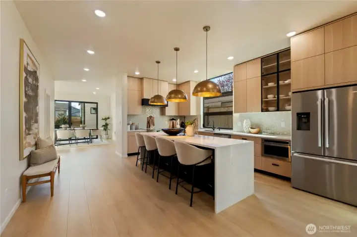 Kitchen on the main level with waterfall island Kitchen on the main level with waterfall island
