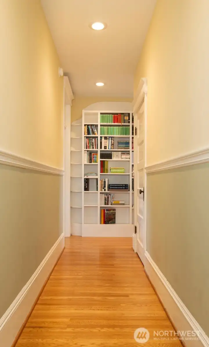 Intentional lighting in the hallway to display art along with built-in shelves for your book and art collections. Intentional lighting in the hallway to display art along with built-in shelves for your book and art collections.
