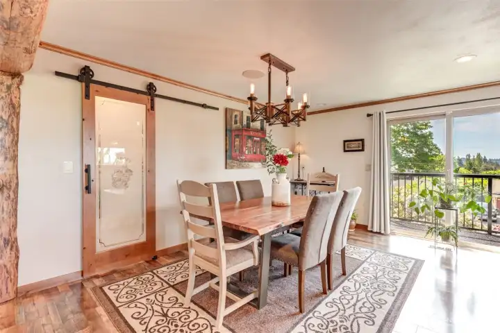 The dining room offers a spacious custom walk-in pantry. Steps away is access to the wrap around deck.
