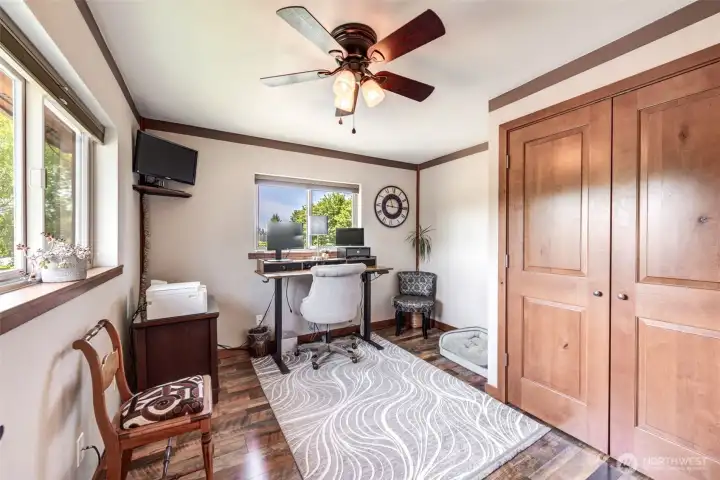 Bright and functional flex space with ample natural light and generous closet storage. Currently a den, possibility for a bedroom.