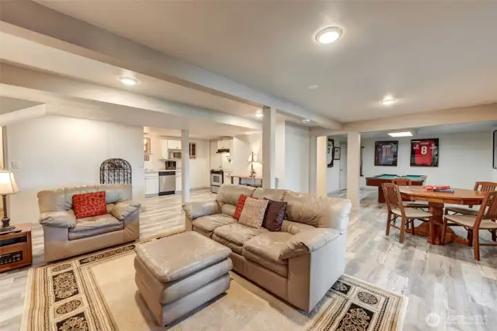 The fully finished lower level lives like a second home, complete with kitchen, living, dining, utility, and entertainment spaces.