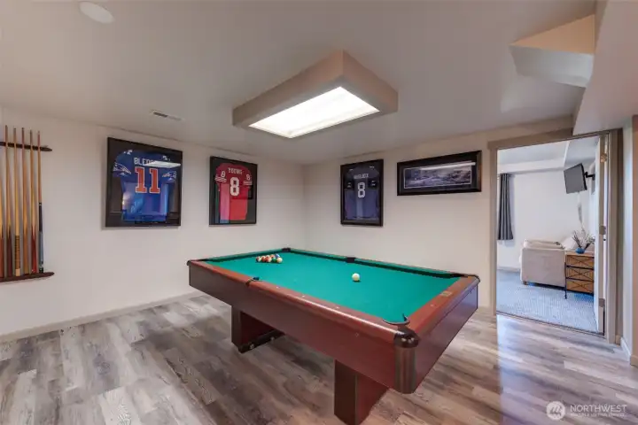 Challenge friends to a game of pool in this dedicated recreation space, with the table included in sale.