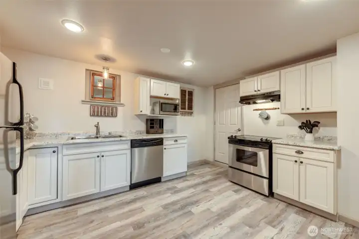 A complete second kitchen allows the lower level to function comfortably as an independent living space.