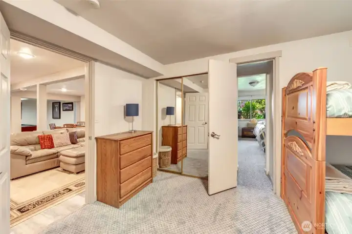 Thoughtfully positioned lower-level bedroom with direct access to an adjoining bedroom, creating an ideal setup for families or guests.