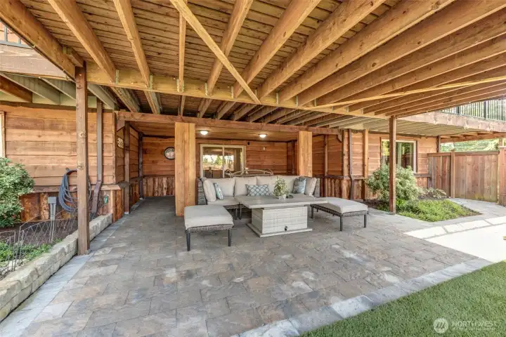 Step out to a spacious covered patio that seamlessly extends the lower-level living experience outdoors.