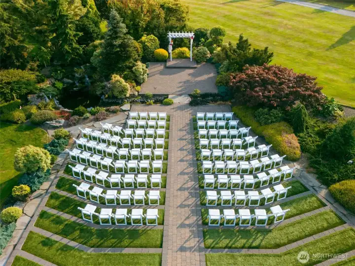 The beautifully terraced ceremony lawn provides an unforgettable setting for weddings, milestone celebrations, family gatherings, and outdoor events, framed by lush gardens, mature trees, and peaceful waterfall and koi pond.