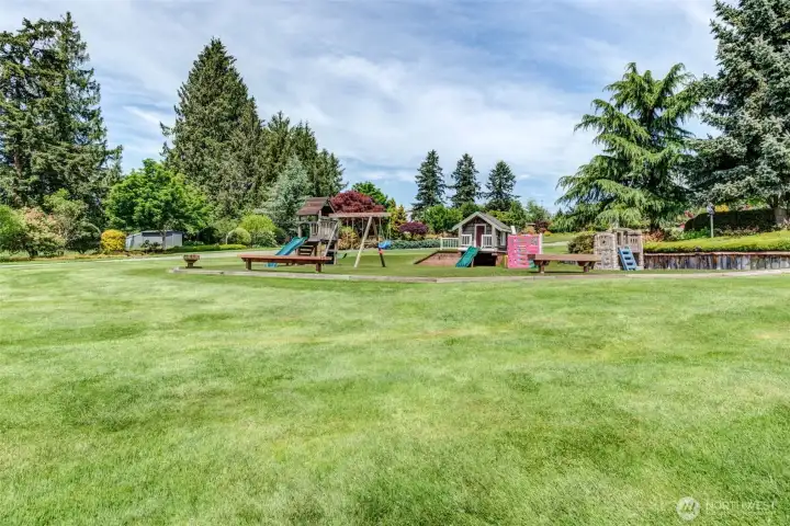 Dedicated playground area positioned within view of the pergola and nearby seating spaces, allowing children to play while remaining easily visible during gatherings, celebrations, or everyday enjoyment of the estate.    VISIT LINKED URLs FOR MORE PHOTOS.