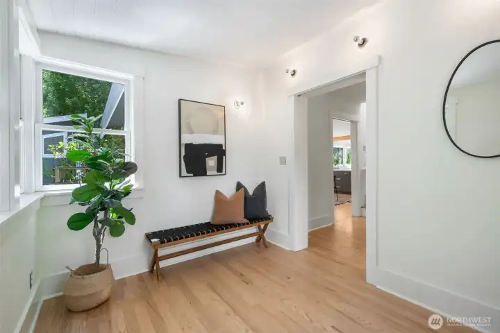 Sunny entryway. Perfect place for a drop zone/mudroom.