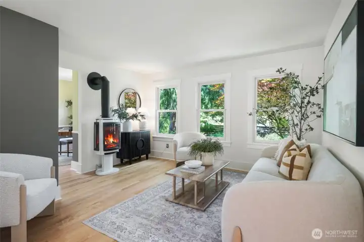 Scandinavian gas fireplace brings cozy vibes to the space.