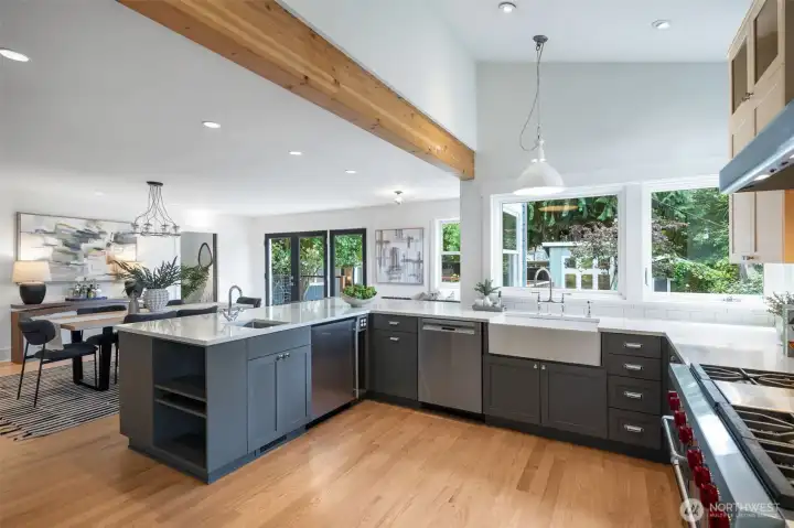 High end appliances and surrounded by windows.
