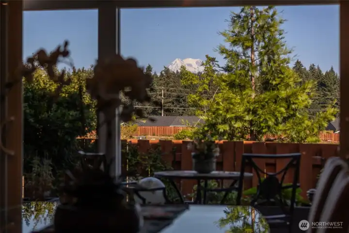 This is the view Pacific Northwesterners dream about. Sitting at the dining table, your eye is naturally drawn through the wall of windows to the breathtaking Mount Rainier backdrop beyond. On clear days, the mountain becomes part of everyday life, whether you're enjoying your morning coffee, hosting brunch with friends or lingering over dinner long after dessert. The beauty of this floorplan is that these views aren't reserved for one special room. They follow you throughout the main living spaces, creating a constant connection to the landscape outside and reminding you exactly why people fall in love with living here.
