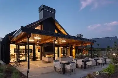 Who says outdoor living is reserved for private backyards? Ovation at Oak Tree delivers a resort-style patio experience that's ready for every season. A massive covered gathering area surrounds the outdoor fireplace, creating a cozy place to connect with friends while enjoying fresh air and beautiful surroundings. Nearby, fire tables and a fully equipped outdoor kitchen set the stage for community celebrations, casual get-togethers and those spontaneous afternoons that somehow turn into dinner plans. The clean contemporary design feels elevated without being stuffy, giving the entire space a relaxed sophistication that invites people to linger a little longer.