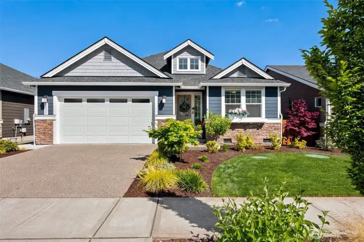 Now this is how you do curb appeal. Beautiful stacked stone accents, rich architectural details and meticulously maintained landscaping create a welcoming first impression before you ever step through the front door. The level driveway makes everyday living easy, while the two-car garage offers plenty of room for vehicles, storage and hobbies. Best of all, the HOA takes care of the front yard maintenance, allowing you to enjoy the benefits of a gorgeous exterior without adding another chore to your weekend list. Inside you'll find 1,754 square feet, three bedrooms, two bathrooms and a versatile den, creating a floorplan that's equally ready for entertaining, overnight guests or simply enjoying the next chapter of life in style.