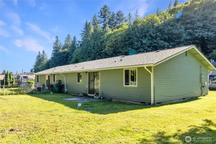 Rear exterior showcasing separate fenced yard areas.