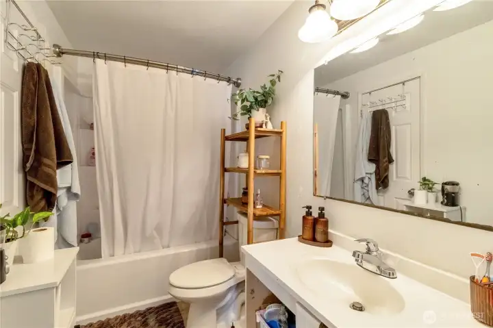 Unit A bathroom with tub/shower combination.