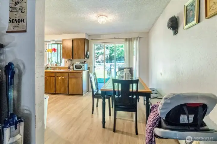 Unit B dining area with sliding door access to the private fenced backyard.