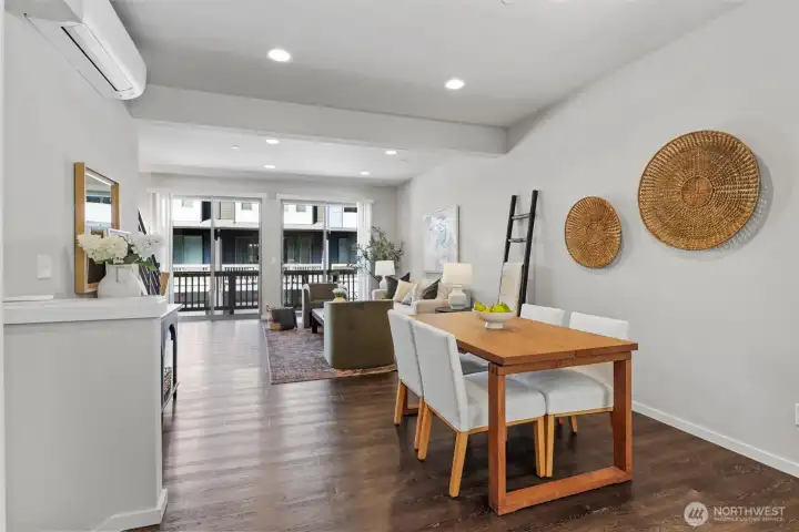Open sightlines between kitchen, dining, and living spaces enhance connection and livability. Open sightlines between kitchen, dining, and living spaces enhance connection and livability.