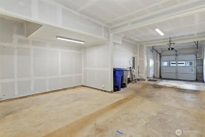 Rare tandem two-car garage offers parking for two vehicles plus additional storage flexibility for bikes, gear, home gym equipment, or extra storage. Rare tandem two-car garage offers parking for two vehicles plus additional storage flexibility for bikes, gear, home gym equipment, or extra storage.