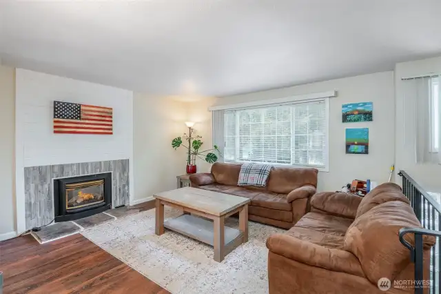 Plenty of natural light in this family room with gas fireplace for chilly winter evenings