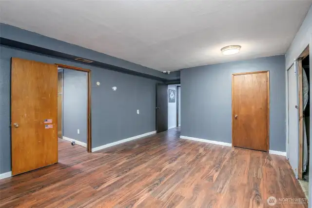 Huge bonus room in basement with door to office/den and storage space