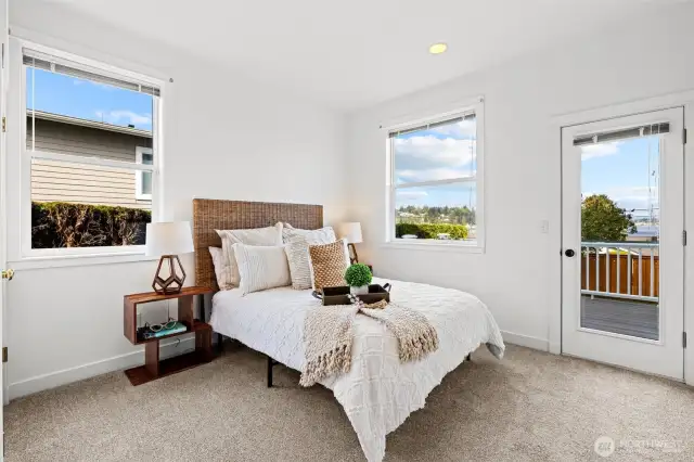 Main floor bedroom lives like guest quarters with a private deck and adjacent full bathroom.