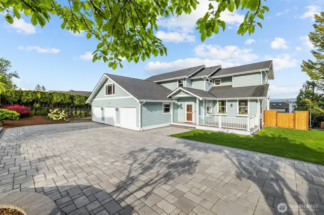 A pristine paver driveway to welcome you home.