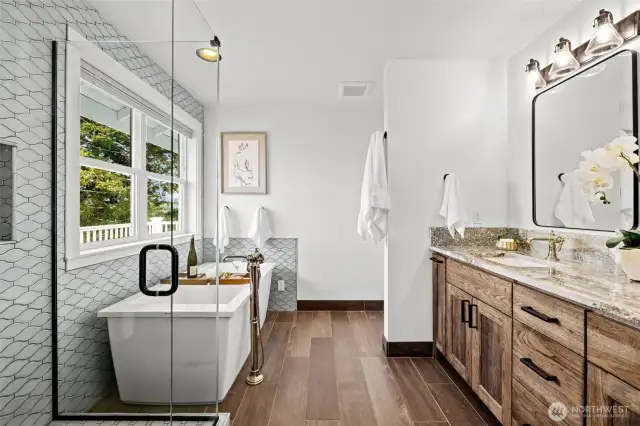 Exquisite en suite. Soaking tub, custom shower, soft closing cabinetry, on point fixtures on more!