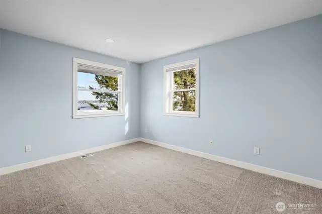 Third upper level bedroom with views.