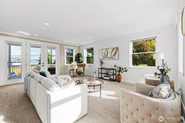 Spacious formal living room with main level entertaining deck access.