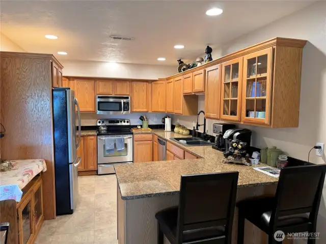 Beautiful kitchen with stainless steel appliances and granite countertops.