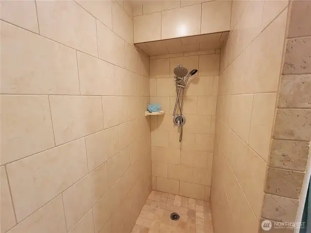 Beautiful tile shower in Master Bathroom.