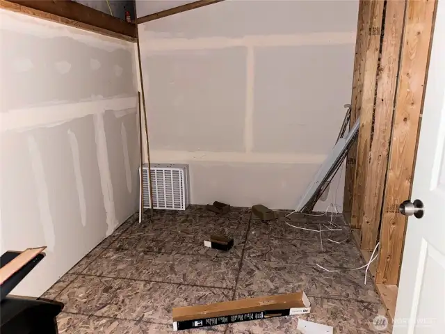 The room was planned to be a bathroom, but could also be storage.