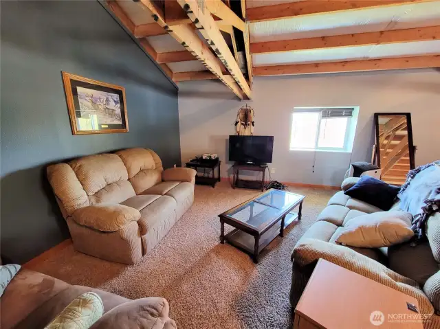 Sitting / TV area in upper large room.