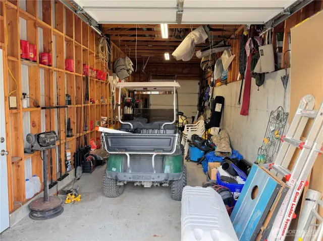 Inside the detached garage. Plenty of room to park cars, boats, toys, or just for storage.