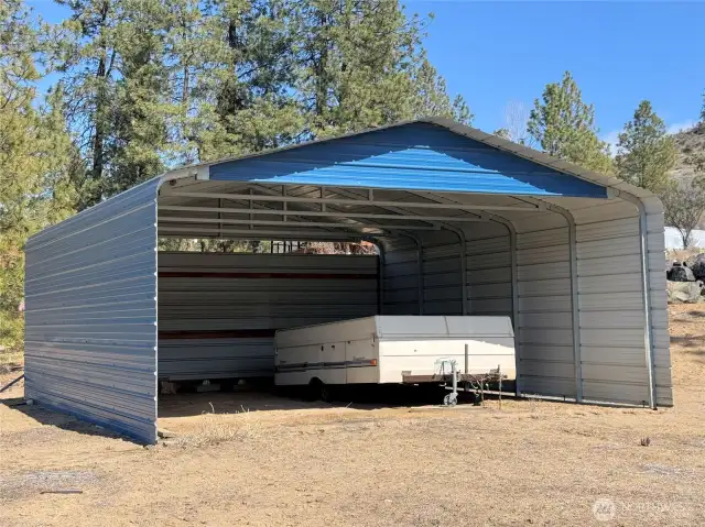 Carport for storing your toys or guest parking.