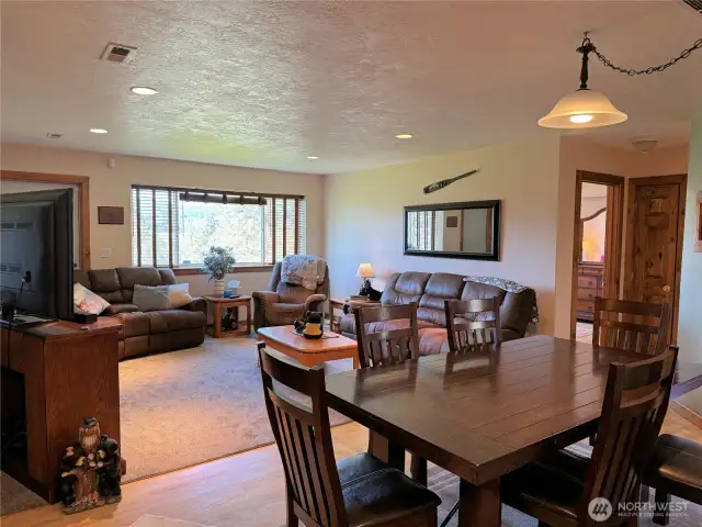 Dinning area next to living room and kitchen.