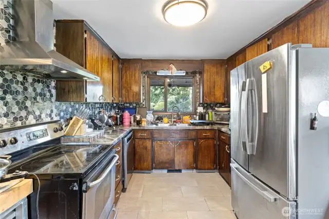Kitchen is solid and cabinets are solid wood. Ceramic tile floors. Appliances stay.