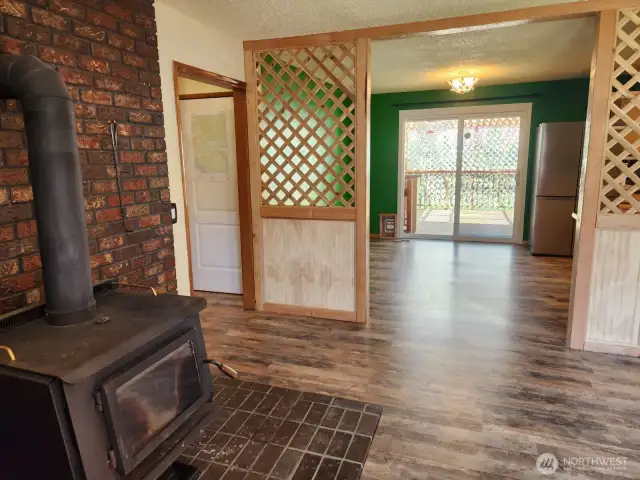 Free standing stove off dining room and kitchen