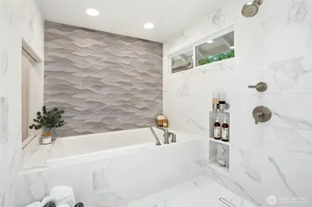 Wet room with a large soaking tub. All top of the line.