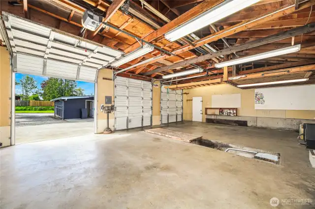 Single man door on side / Wood burning stove / Work bench  Covered area on exterior for wood and other storage