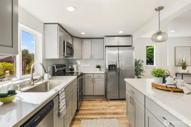 Sunny kitchen w/ a sink that overlooks the spacious yard.