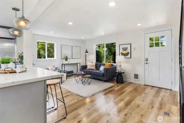 Spacious living room with gleaming floors.