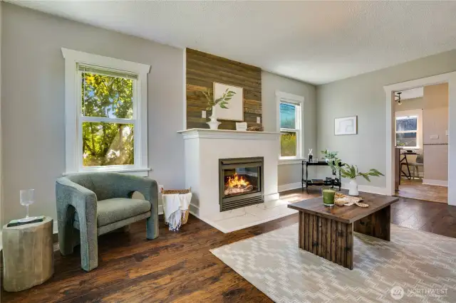 Enter in to an inviting living space with a gas fireplace