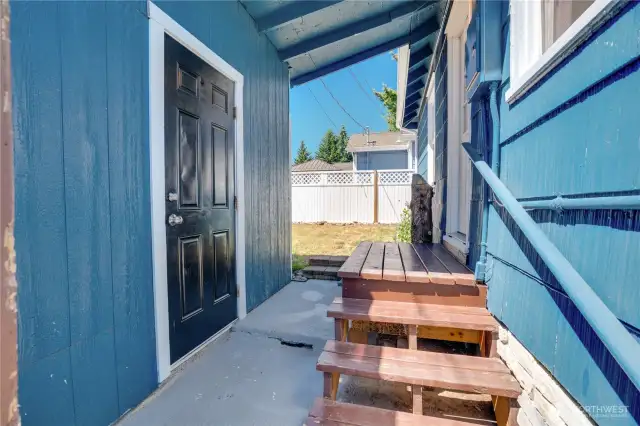 Covered walkway to the converted garage space