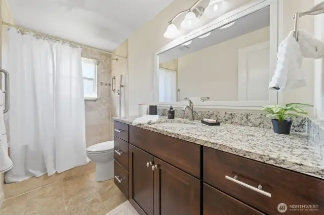 Main bathroom with beautiful tiled shower