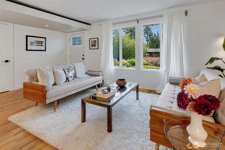 The open floor plan allows for easy entertaining. The door on the left is a large coat closet.