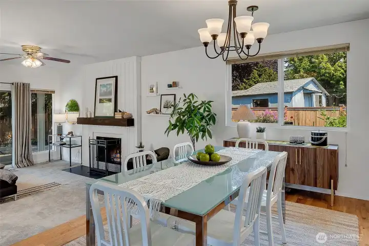 The dining area easily accommodates a Thanksgiving crowd or an intimate dinner party with friends. Large windows look out to the built-in garden beds ready for your flower garden or veggie patch.