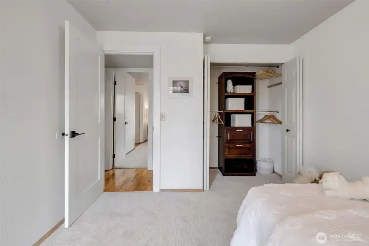 Second bedroom off the main hall with a built-in closet unit, new paint and carpet.