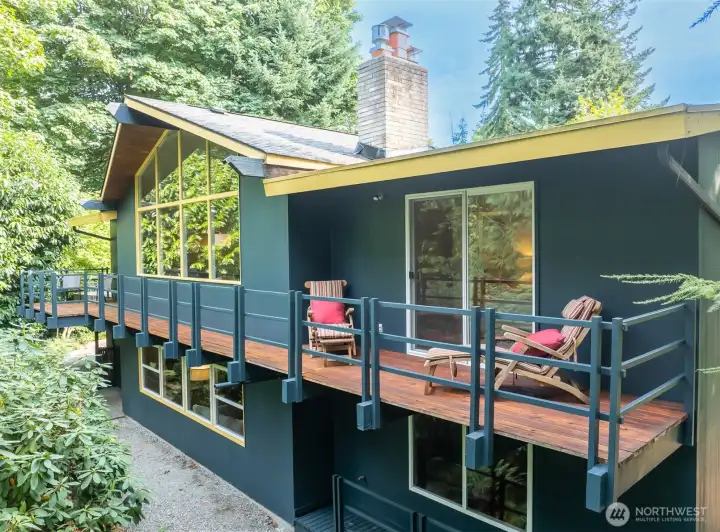 Enjoy seamless indoor-outdoor living on this expansive cedar deck spanning the home’s entire length.